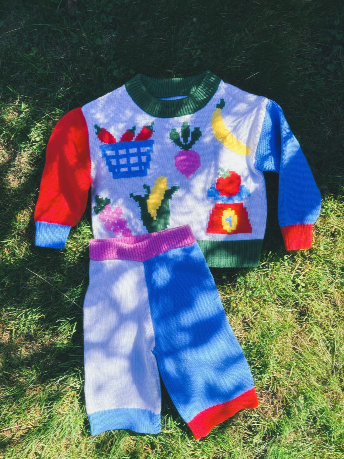 Market Day jumper and trousers set laid on the grass