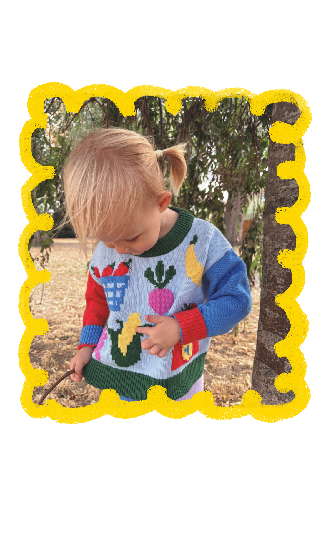 Child wearing the Market Day knitted jumper and trousers outdoors, framed by a hand-drawn yellow border